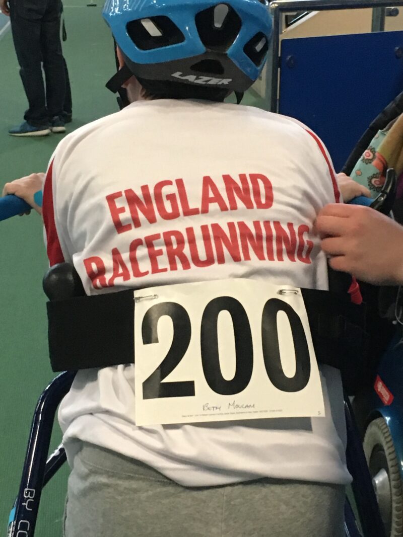 cerebral palsy athlete wearing England racerunning kit