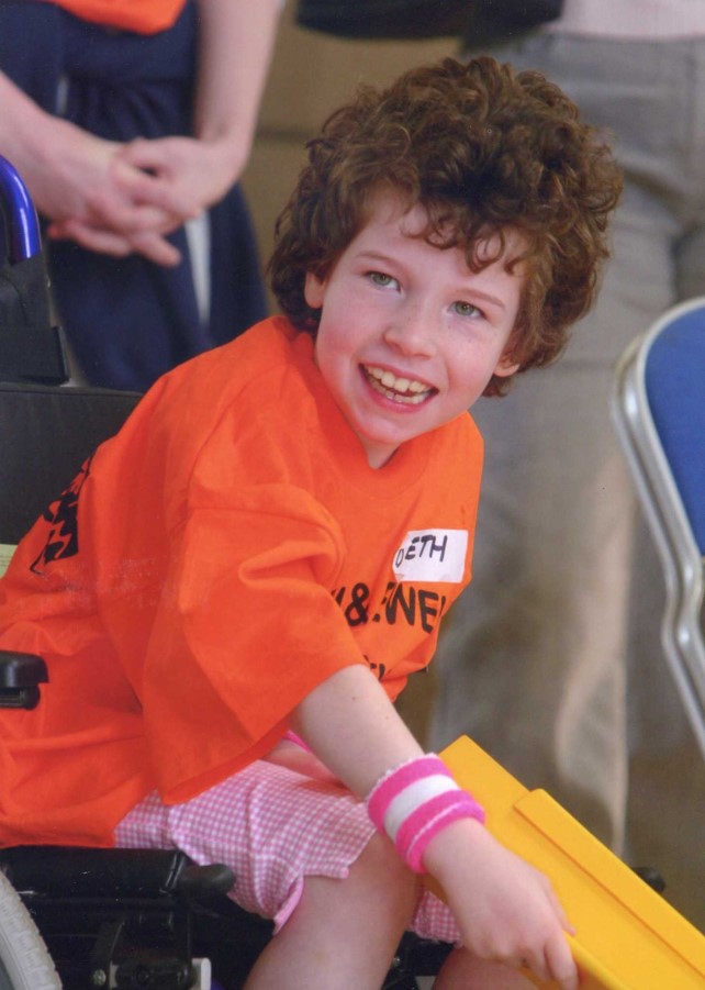 Beth Moulam, 10 year old boccia player, cerebral palsy, wearing orange t shirt
