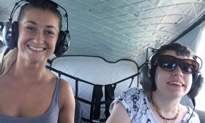 Beth Moulam AAC user with cerebral palsy. Flying with a personal assistant over the Great Barrier Reef