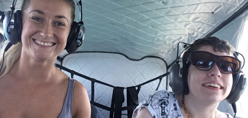 Beth Moulam AAC user with cerebral palsy. Flying with a personal assistant over the Great Barrier Reef