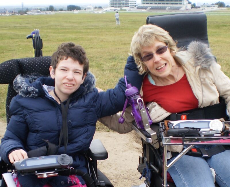 Beth Moulam and Mel from Australia both with communication aids, AAC, in power wheelchairs