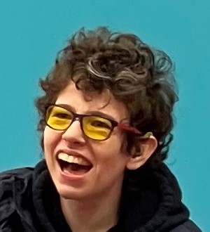 Cerebral palsy and synaesthesia, wearer finds yellow glasses help with reading by stopping letters jumping on the page