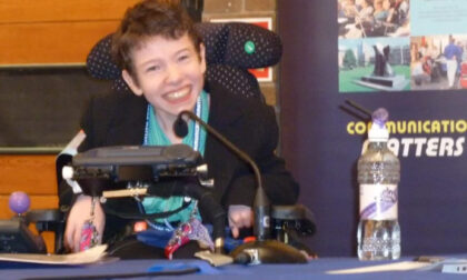 Beth Moulam with cerebral palsy, using AAC to deliver presentation at Communication Matters conference 2009
