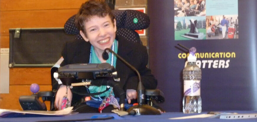 Beth Moulam with cerebral palsy, using AAC to deliver presentation at Communication Matters conference 2009