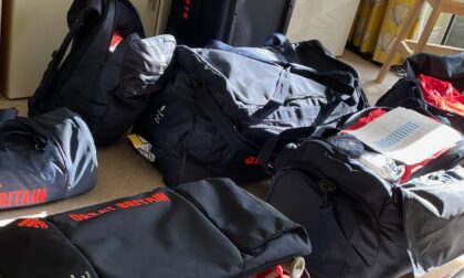 Open bags and suitcases in navy blue with Great Britain logos