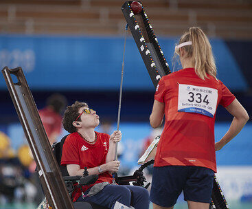 Beth Moulam with CP, playing boccia with ramp supported by sports assistant. Tokyo 2020 paralympics