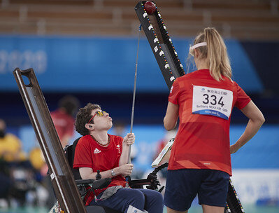 Beth Moulam with CP, playing boccia with ramp supported by sports assistant. Tokyo 2020 paralympics