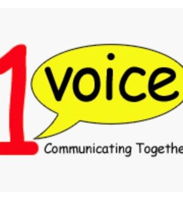 1 voice communicating together logo. Red number 1, Yellow speech bubble with the word voice underlined at bottom by communicating together.
