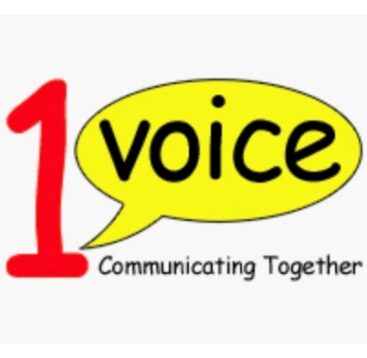 1 voice communicating together logo. Red number 1, Yellow speech bubble with the word voice underlined at bottom by communicating together.