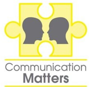 Communication Matters International conference. Yellow jigsaw piece with two heads facing each other communicating