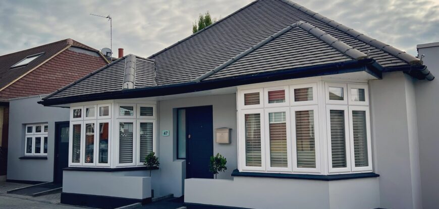 Ablestay London external view, grey bungalow with ramped access