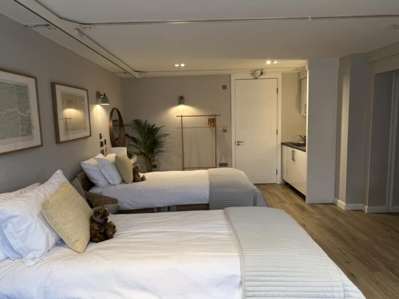 Spacious Ablestay bedroom with 2 profile beds and hoist into the ensuite bathroom