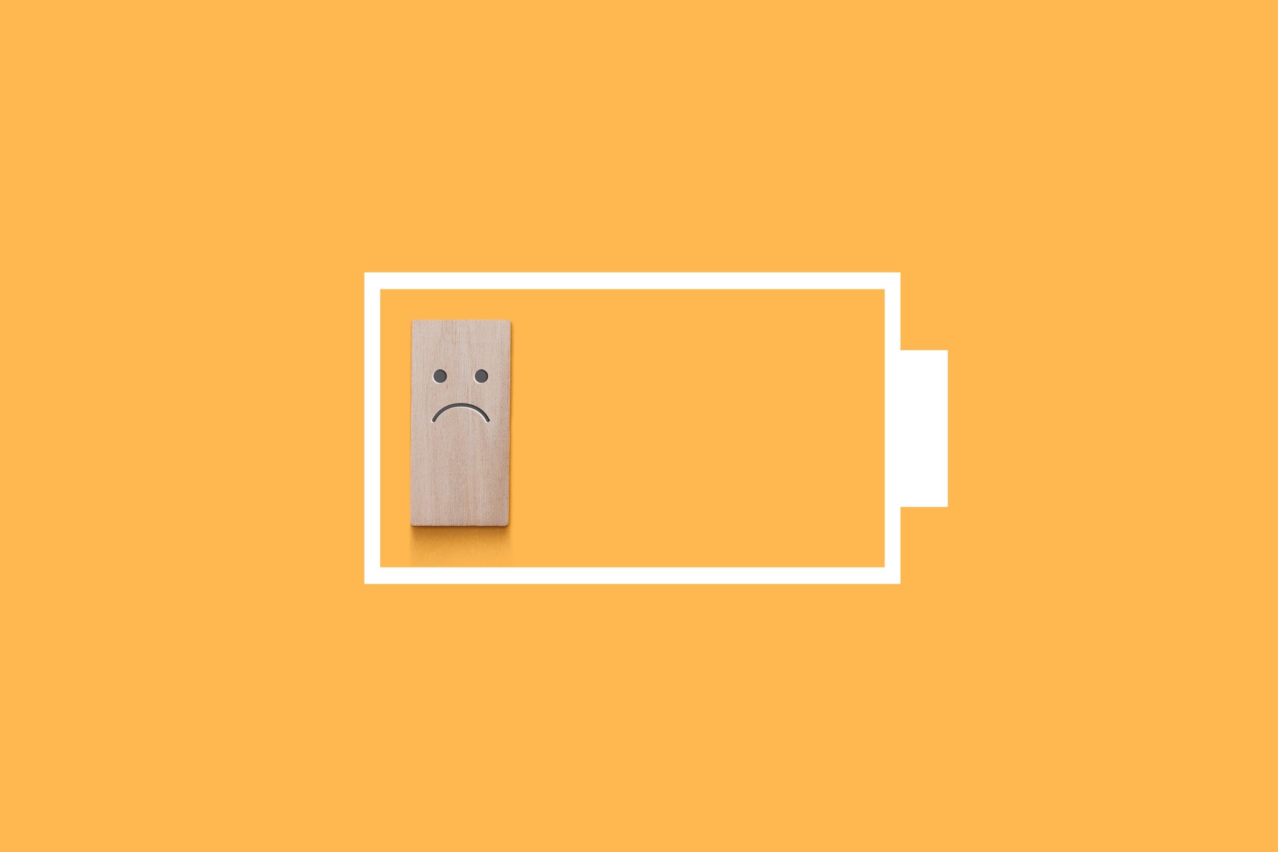 Yellow background, battery depleted with sad face icon, AAC