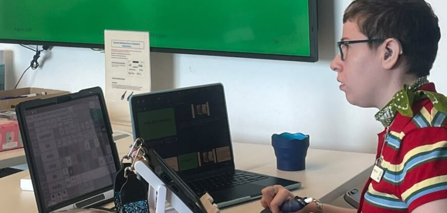 Beth presenting using AAC on why AAC matters